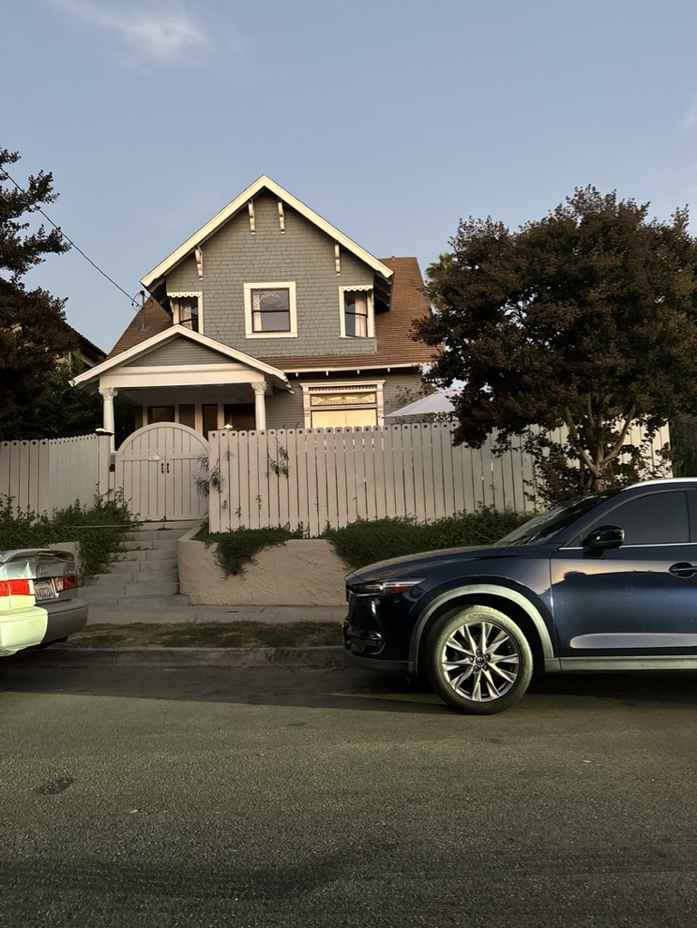 Residential exterior with white fence