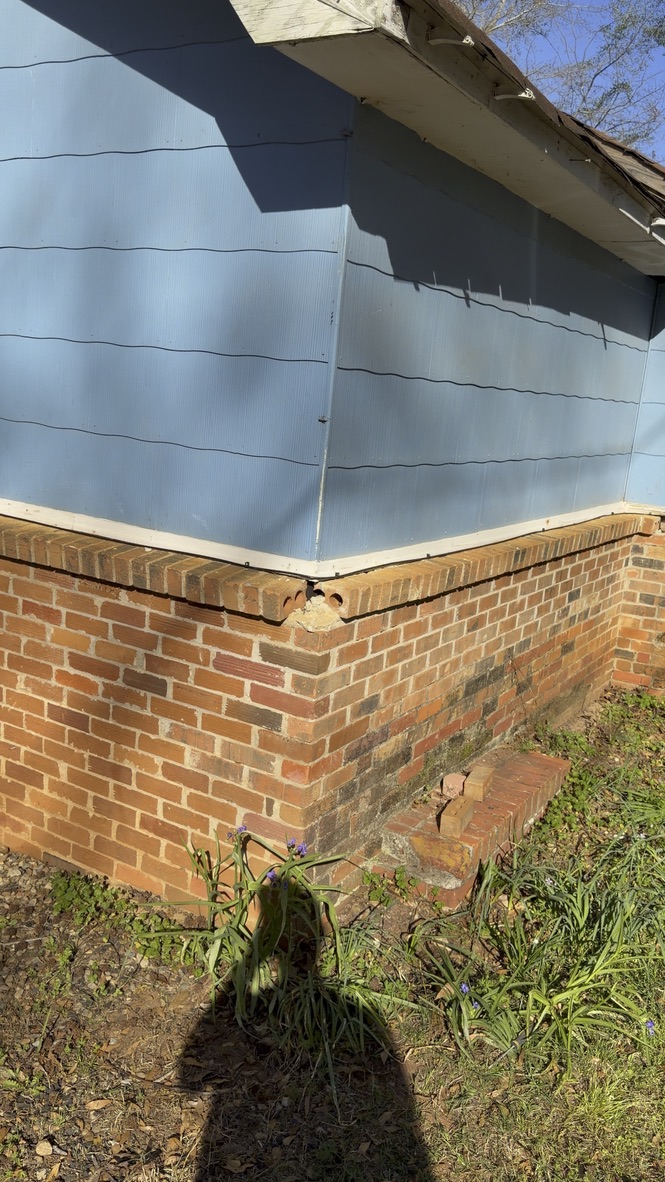 Close exterior foundation view of 101 Law Avenue